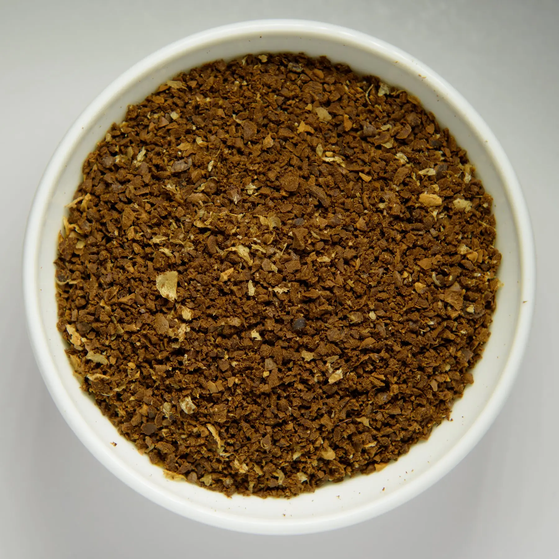 A bowl of used coffee grounds