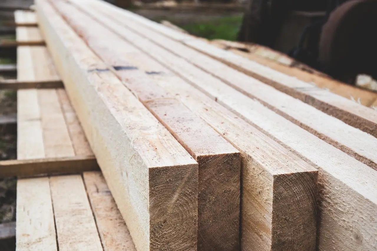 A stack of sawn timber lengths with the cut ends facing the camera